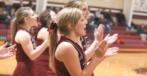 Bronco Cheerleaders Sterling King, Skyler White, Jentry Shadle, and Maci White pump up the crowd during the game against Vega. Enterprise Photo / Matthew Martinez