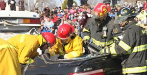 Volunteer firemen and EMS personnel work to free high school senior Chance Rolland from a mock crash site at Clarendon ISD Monday morning as part of the CHS Student Council’s “Shattered Dreams” program. Enterprise Photo / Roger Estlack