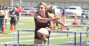 Jentry Shadle runs the hurdles last week.