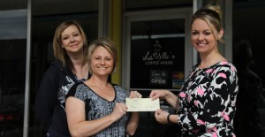 Becky Rattan and Michelle Hall of LaVelle’s Coffee House accept a check from Clarendon Tourism & Economic Development  Director Chandra Eggemeyer last Friday. Enterprise photo 