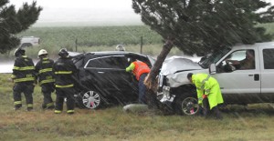 Emergency personnel respond to a two-vehicle accdent east of Clarendon Monday where a Childress man lost his life. Enterprise Photo / Roger Estlack