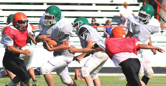 Senior Seth Ruthardt carries the ball in a scrimmage against Higgins at Lefors.Enterprise Photo / Kari Lindsey
