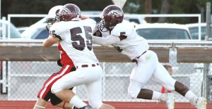 Clarendon’s Zach Cornell (55) and Charles Mason (5) chase down a Gruver Greyhound last Friday. Courtesy Photo / Melody Hysinger