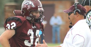 Junior Bronco Dustin Crump talks with Coach Nino before taking the field during last Saturdays game against Wheeler.