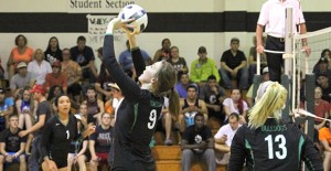 Lady Bulldog Penny Holdren of Snyder sets the ball for Kaitlyn Schaffner of Burkburnett during the ladies game against NMMI last Wednesday.  Enterprise Photo / Roger Estlack