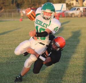 Klaiton Moore carries the ball during the clash with Higgins Friday night.  Enterprise Photo / Kari Lindsey