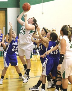 Hedley Lady Owls Basketball begins a new season with a new coach. Bailey Wood executes a move during a season opening game against the Stratford Lady Elks. Courtesy Photo / Hedley Yearbook