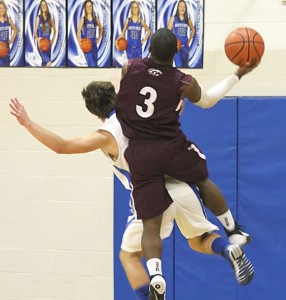 Charles Mason scores over a White Deer player during Tuesdays game. Courtsey Photo Melody Hysinger
