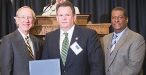 Dr. Dan R. Jones, President of Texas A&M University-Commerce and Stan McKee, Alumni Association President, present Alumni Ambassador Citation to Educational Leadership Alumni Ambassador, Dr. Robert Riza.