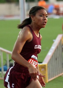 Abby Johnson runs the 400-meter dash. Enterprise Photos / Travis Harsch