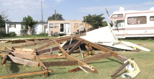 The property of Melodean Mitchell shows the full force of Saturday’s storm with the remains of the home’s roof strewn about the area. Enterprise Photo / Roger Estlack 