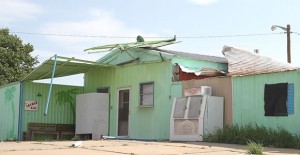 Bent and twisted metal shows the force of Saturday's storm at the old Canteen building. Enterprise Photo / Roger Estlack