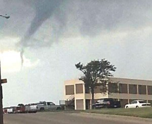 A funnel cloud dances over Clarendon College last Thursday. Photo by Tyler and Ryder Drackley