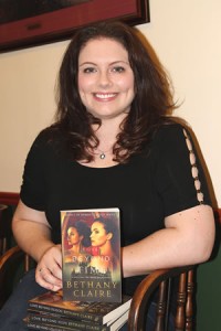 Morgan Hysinger with her first book, Love Beyond Time. Enterprise Photo / Roger Estlack