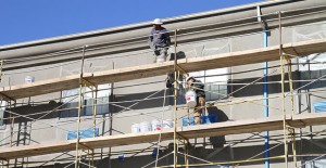 Workers have been applying new surfacing to the exterior of Clarendon’s Red River Inn as part of an overall makeover of the property. Enterprise PHoto