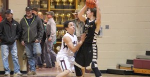 Cedrick McCampbell gaurds the Wheeler offense during last weeks game. The Broncos defeated the Mustangs, 72-38. The Clarendon Bronco basketball team finished second in District 2A this season. Courtesy Photo / Larry Jeffers