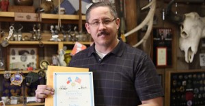 Texas Admiral Kevin Johnson show the certificate signed by former Gov. Rick Perry that gives him a rare title as an officer in the Texas Navy. Enterprise Photo / Roger Estlack