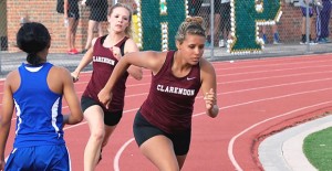 Jensen Hatley & Taylor DeGrate running the sprint relay at Highland Park Track Meet on Thursday April, 2. Enterprise Photo / Alice Cobb