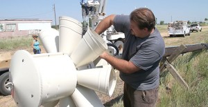 Dan Shaney of Storm Sirens, Inc., prepares part of Howardwick’s new storm warning system for installation Tuesday morning. Enterprise Photo / Roger Estlack