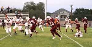 Senior Caleb Cobb carries the ball for the Clarendon Broncos during their Homecoming game against Booker last Friday. The Broncos defeated the Kiowas 22-20. Enterprise photo / Roger Estlack