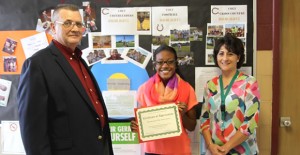 Mayor Larry Hicks presented a certificate of appreciation to Kira Weatherton and Mrs. Grahn on behalf of the city for their volunteer service at Prospect Park. Enterprise Photo / Roger Estlack