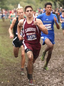 CHS cross country runner Bryce Grahn soldiers through the mud and muck to place sixth in the state meet last week. Enterprise Photo / Travis Harsch
