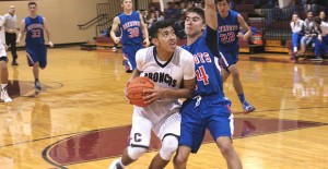 Senior Junior Ceniceros drives to the basket to score two for the Broncos during last Tuesday’s home game against Valley. Courtesy photo / Suzanne Taylor Clarendon CISD