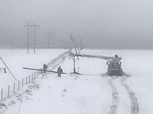 A Greenbelt Electric crew replaces broken poles on the McDowell Ranch near Shamrock. The cooperative lost 250 poles in the storm. Courtesy Photo / Greenbelt Electric