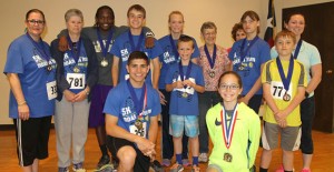 Bryce Grahn and Hannah Fansler (kneeling front) had the best times in the men’s and women’s divisions of the fourth annual Chance Mark Jones Roar ‘N Run 5K Saturday morning at Clarendon College. Enterprise Photo / Roger Estlack