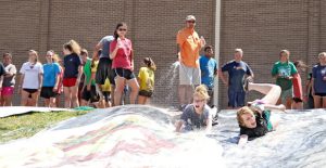 Area I FFA Association President Ryleigh Carson of the Valley FFA Chapter and Area I FFA Association Reporter Mallory Schilling of the Farwell FFA Chapter go head first down the slip-n-slide at the FFA Leadership Conference at Clarendon College last Wednesday. The outdoor activities closed out the three-day camp, which drew 340 students to the campus. Enterprise Photo / Morgan Wheatly