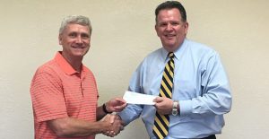 CISD Superintendent Mike Norrell presents a check for $7,000 to CC President Robert Riza for the PEAK Scholarship Fund from monies raised during the 2015-2016 school year. CC Photo