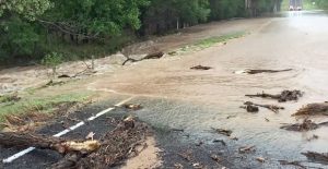 Rushing water from Kelly Creek blocks traffic on Farm Road 3257 between US 287 and Greenbelt Lake Monday morning. TxDOT also closed FM 3257 Monday night as heavy rains continued to soak the area. This an other recent rains has brought the level of Greenbelt about three feet in the ten days before this Tuesday, and more rain is in the forecast for this week. Courtesy Photo / Briley Chadwick