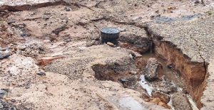 City streets took a beating during the recent rains such as this hole that developed at Browning and Carhart streets in Clarendon. Courtesy photo / Laura Luttrell