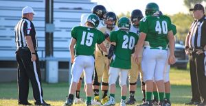 Representing the Owls, Captains Kade McCleskey, Wyatt Papa, Caylor Monroe, and Issac Booth meet for the coin toss before the game in McLean last Friday. The Owls will travel to Lefors on September 2, with play starting at 7:30. Courtesy Photo / Kylie Wood