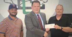 Clarendon College President Robert Riza (center) receives a check from AEP/Southwestern Electric Power Co. Customer Service Representative Tony Barley (right) for $5,382.30 through SWEPCO’s incentive SCORE program that encourages energy efficiency. Also pictured is SWEPCO District System Supervisor Cory Hightower. CC Photo / Ashlee Estlack