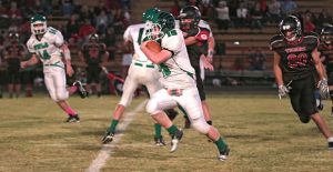 Kade McCleskey gains yards against the Groom Tigers in Hedley’s district opener. Hedley will travel to Silverton this week, and will be at home for their last game on November 4th. Enterprise photo / Kari Lindsey