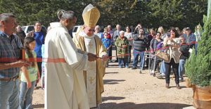 Father Arokia Raj Samala and Bishop Patrick J. Zureck cut the ribbon on the new Parish Hall at St. Mary’s Catholic Church Sunday afternoon as parishoners look on. An open house for the new hall will be held Sunday, December 4, from 1 to 4 p.m.Enterprise Photo / Roger Estlack