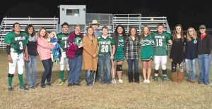The Hedley Seniors and their sponsors enjoy a last walk on their home field after the Owls game against Valley last Friday. Enterprise Photo / Kari Lindsey